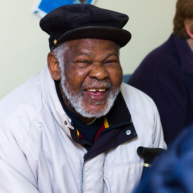 Cambridgeshire NHS Trust Case Study Image. Cambridgeshire NHS staff member smiling