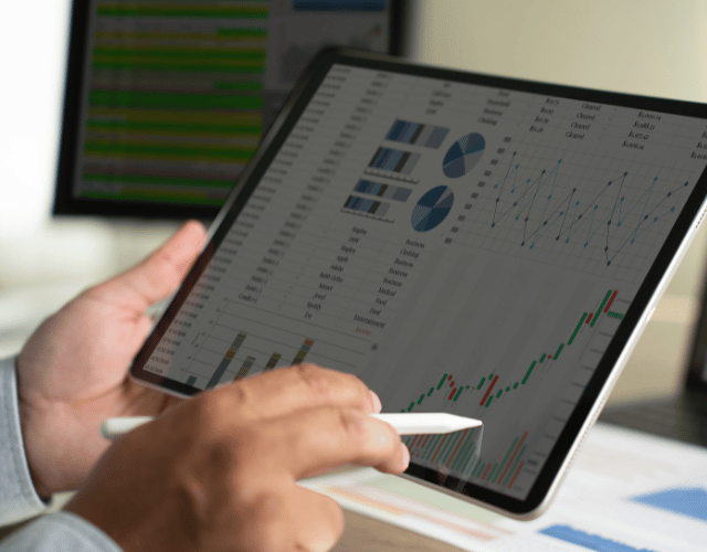 Male looking at graph on electronic device