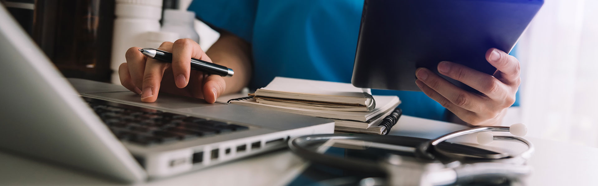 Medical technology concept. Doctor working with mobile phone and stethoscope and digital tablet laptop