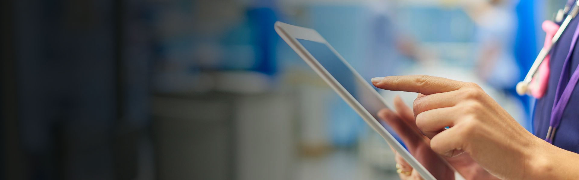 a nurse holding a computer tablet