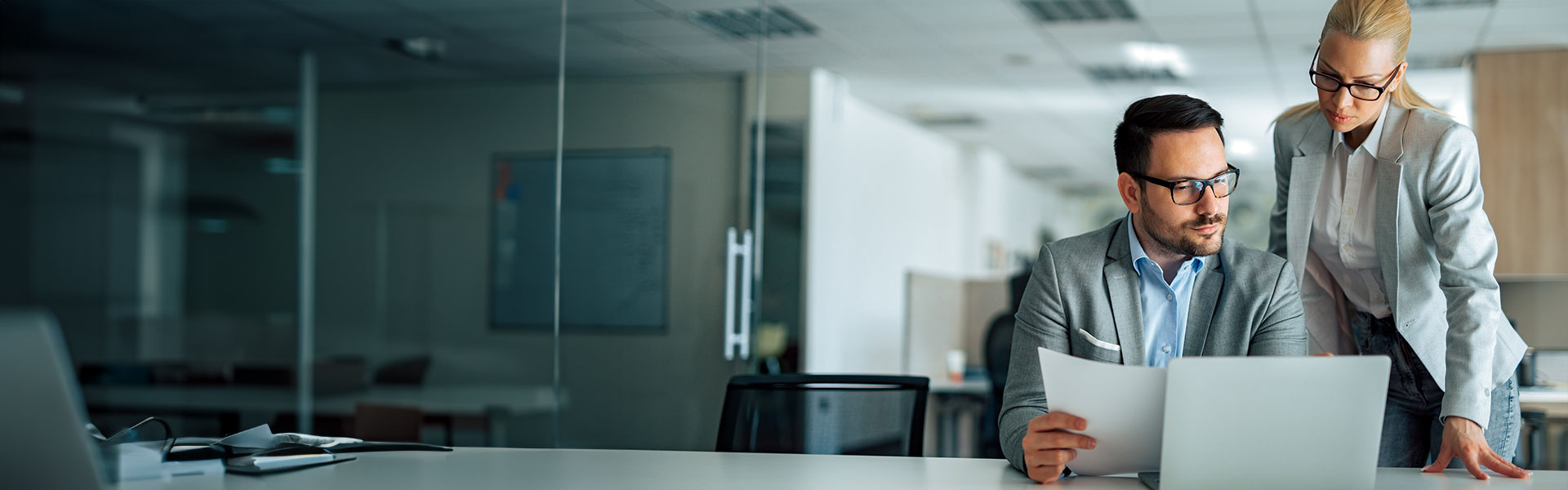 business-service-framework-agreement--banner showing two people working in an office