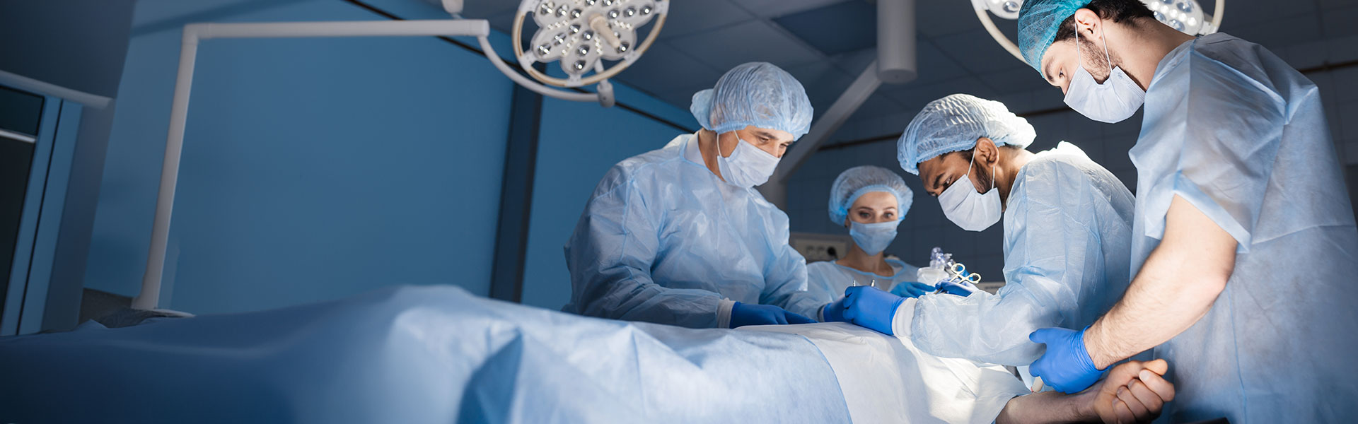 Stitching after a complex and bloody surgery. Modern medical equipment allow surgeons to perform delicate and accurate operations. Professional treatment