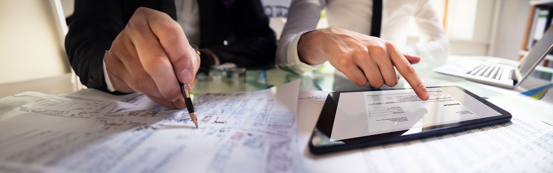 Businessperson Analyzing Invoice On Digital Tablet